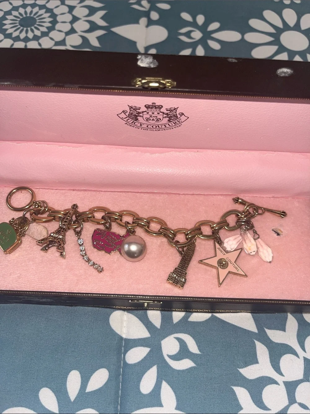 Juicy Couture Gold Tone Charm Bracelet with Pink and Pearl Accents